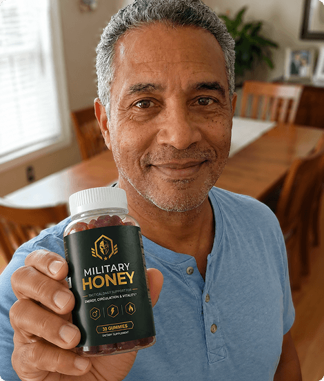 Bill Henderson holding Military Honey in his workshop